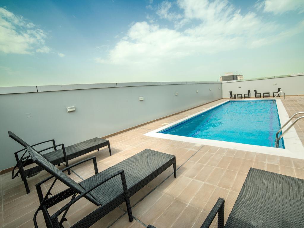 Golden Rose Luxury Suites Manamah Buitenkant foto