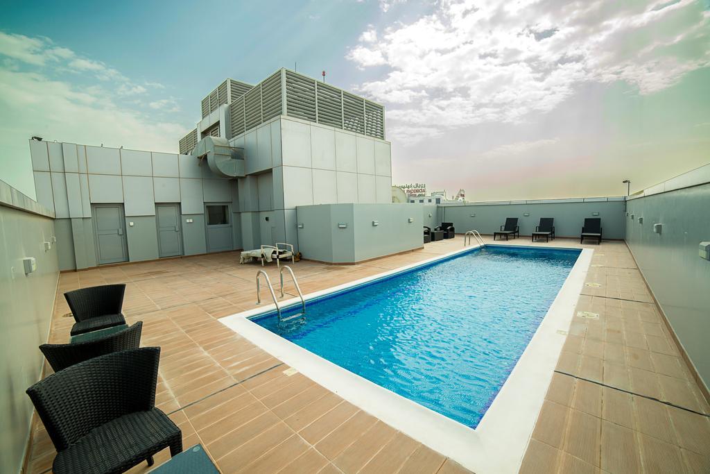 Golden Rose Luxury Suites Manamah Buitenkant foto